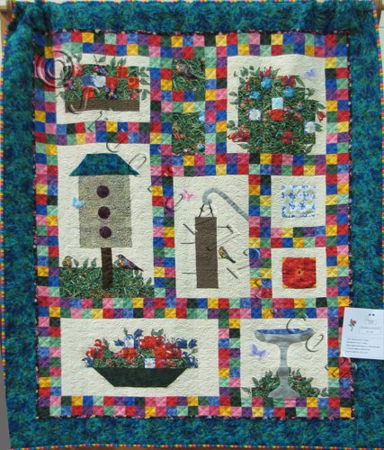 http://studio2724.com/wp-content/uploads/2011/07/04-Birds-Blooms-and-Butterflies-A-Challenge-Quilt-WM.jpg